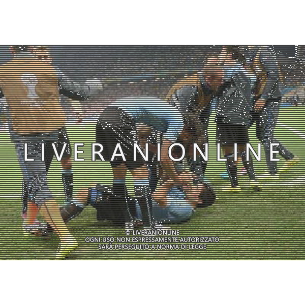 (140619) -- SAO PAULO, June 19, 2014 () -- Uruguay\'s Luis Suarez (down) celebrates for the victory with his teammates after a Group D match between Uruguay and England of 2014 FIFA World Cup at the Arena de Sao Paulo Stadium in Sao Paulo, Brazil, June 19, 2014.Uruguay won 2-1 over England on Thursday.(/Li Ga)(pcy) 2014 FIFA World Cup Brazil Group D match between Uruguay and England at Arena de Sao Paulo on June 19, 2014 in Sao Paulo, Brazil. ©photoshot/Agenzia Aldo Liverani sas - ITALY ONLY - EDITORIAL USE ONLY