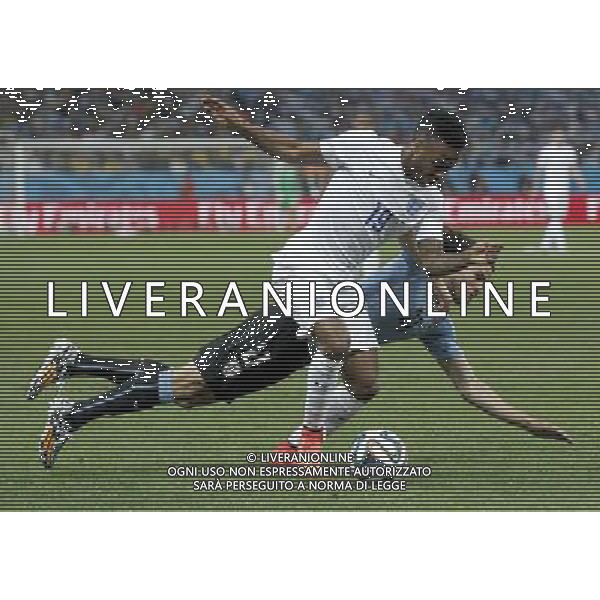 (140619) -- SAO PAULO, June 19, 2014 () -- England\'s Raheem Sterling (front) vies with Uruguay\'s Edinson Cavani during a Group D match between Uruguay and England of 2014 FIFA World Cup at the Arena de Sao Paulo Stadium in Sao Paulo, Brazil, June 19, 2014. Uruguay won 2-1 over England. (/Zhou Lei)(xzj) 2014 FIFA World Cup Brazil Group D match between Uruguay and England at Arena de Sao Paulo on June 19, 2014 in Sao Paulo, Brazil. ©photoshot/Agenzia Aldo Liverani sas - ITALY ONLY - EDITORIAL USE ONLY