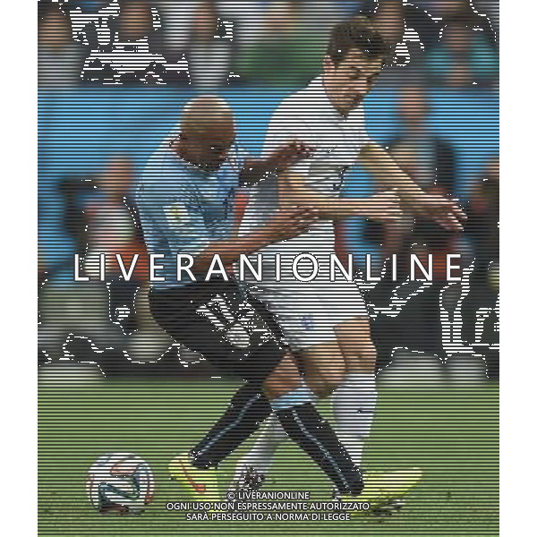 (140619) -- SAO PAULO, June 19, 2014 () -- England\'s Leighton Baines (R) vies with Uruguay\'s Egidio Arevalo Rios during a Group D match between Uruguay and England of 2014 FIFA World Cup at the Arena de Sao Paulo Stadium in Sao Paulo, Brazil, June 19, 2014.(/Li Ga)(pcy) 2014 FIFA World Cup Brazil Group D match between Uruguay and England at Arena de Sao Paulo on June 19, 2014 in Sao Paulo, Brazil. ©photoshot/Agenzia Aldo Liverani sas - ITALY ONLY - EDITORIAL USE ONLY