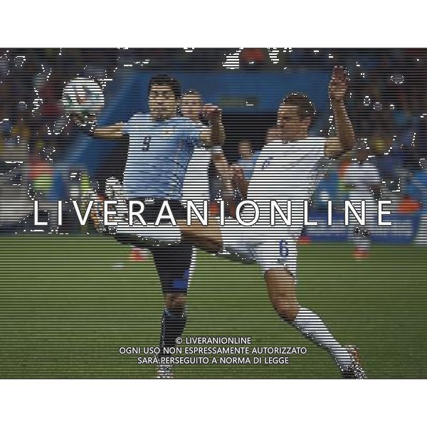 (140619) -- SAO PAULO, June 19, 2014 () -- Uruguay\'s Luis Suarez vies with England\'s Phil Jagielka during a Group D match between Uruguay and England of 2014 FIFA World Cup at the Arena de Sao Paulo Stadium in Sao Paulo, Brazil, June 19, 2014.(/Chen Jianli)(rh) 2014 FIFA World Cup Brazil Group D match between Uruguay and England at Arena de Sao Paulo on June 19, 2014 in Sao Paulo, Brazil. ©photoshot/Agenzia Aldo Liverani sas - ITALY ONLY - EDITORIAL USE ONLY