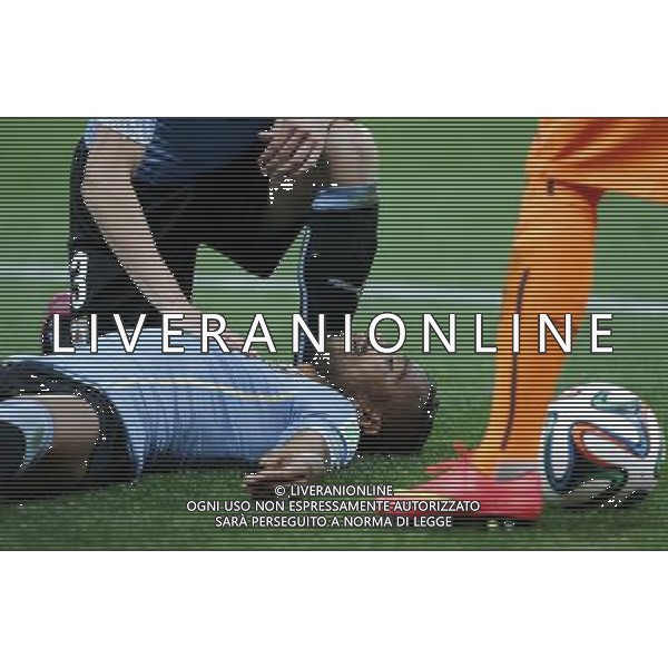 (140619) -- SAO PAULO, June 19, 2014 () -- Uruguay\'s Alvaro Pereira (bottom) passed out on the ground after being hit on the head by England\'s Raheem Sterling during a Group D match between Uruguay and England of 2014 FIFA World Cup at the Arena de Sao Paulo Stadium in Sao Paulo, Brazil, June 19, 2014.(/Zhou Lei)(xzj) 2014 FIFA World Cup Brazil Group D match between Uruguay and England at Arena de Sao Paulo on June 19, 2014 in Sao Paulo, Brazil. ©photoshot/Agenzia Aldo Liverani sas - ITALY ONLY - EDITORIAL USE ONLY