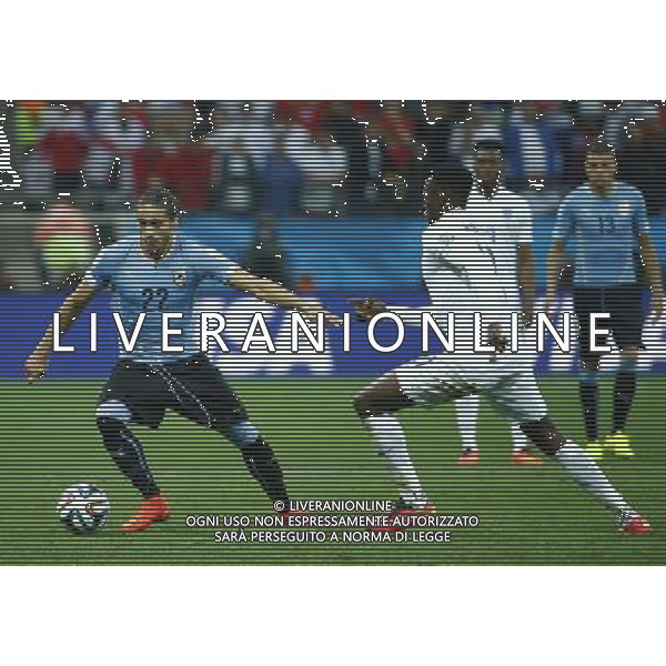 (140619) -- SAO PAULO, June 19, 2014 () -- Uruguay\'s Martin Caceres controls the ball during a Group D match between Uruguay and England of 2014 FIFA World Cup at the Arena de Sao Paulo Stadium in Sao Paulo, Brazil, June 19, 2014.(/Chen Jianli)(rh) 2014 FIFA World Cup Brazil Group D match between Uruguay and England at Arena de Sao Paulo on June 19, 2014 in Sao Paulo, Brazil. ©photoshot/Agenzia Aldo Liverani sas - ITALY ONLY - EDITORIAL USE ONLY