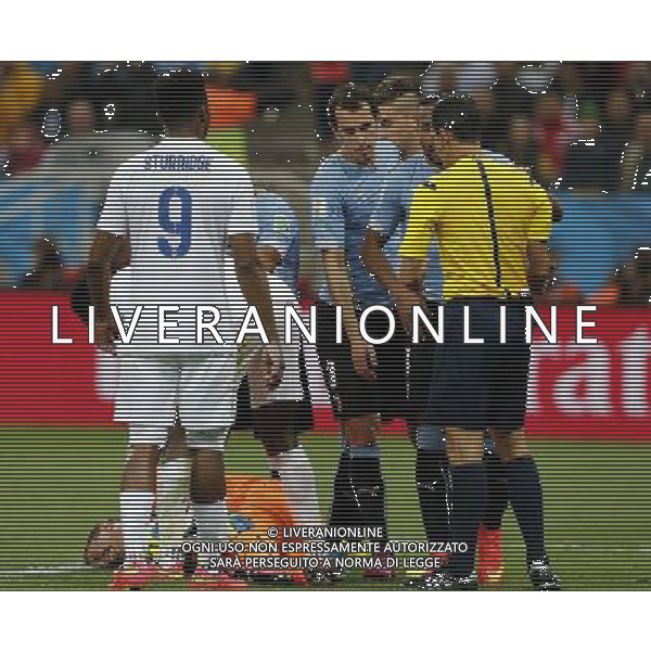 (140619) -- SAO PAULO, June 19, 2014 () -- Uruguay\'s goalkeeper Fernando Muslera (bottom) lies on the ground after being hit during a Group D match between Uruguay and England of 2014 FIFA World Cup at the Arena de Sao Paulo Stadium in Sao Paulo, Brazil, June 19, 2014.(/Zhou Lei)(xzj) 2014 FIFA World Cup Brazil Group D match between Uruguay and England at Arena de Sao Paulo on June 19, 2014 in Sao Paulo, Brazil. ©photoshot/Agenzia Aldo Liverani sas - ITALY ONLY - EDITORIAL USE ONLY