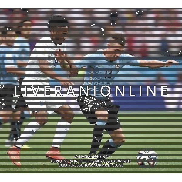 (140619) -- SAO PAULO, June 19, 2014 () -- England\'s Raheem Sterling (L) vies with Uruguay\'s Jose Maria Gimenez during a Group D match between Uruguay and England of 2014 FIFA World Cup at the Arena de Sao Paulo Stadium in Sao Paulo, Brazil, June 19, 2014.(/Li Ga)(pcy) 2014 FIFA World Cup Brazil Group D match between Uruguay and England at Arena de Sao Paulo on June 19, 2014 in Sao Paulo, Brazil. ©photoshot/Agenzia Aldo Liverani sas - ITALY ONLY - EDITORIAL USE ONLY