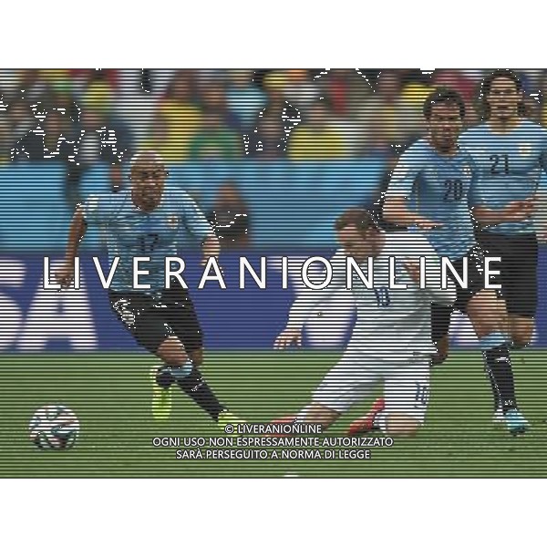 (140619) -- SAO PAULO, June 19, 2014 () -- England\'s Wayne Rooney (C) falls down in a competition with Uruguay\'s Egidio Arevalo Rios (L) during a Group D match between Uruguay and England of 2014 FIFA World Cup at the Arena de Sao Paulo Stadium in Sao Paulo, Brazil, June 19, 2014.(/Li Ga)(pcy) 2014 FIFA World Cup Brazil Group D match between Uruguay and England at Arena de Sao Paulo on June 19, 2014 in Sao Paulo, Brazil. ©photoshot/Agenzia Aldo Liverani sas - ITALY ONLY - EDITORIAL USE ONLY