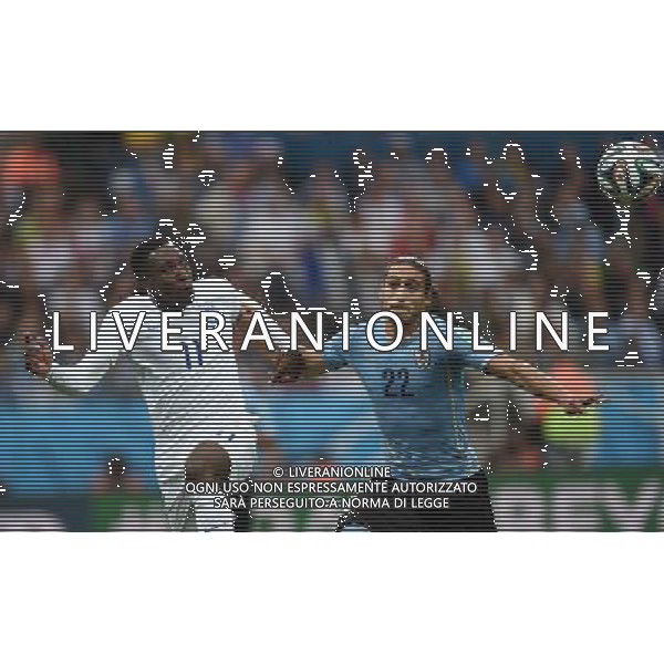 (140619) -- SAO PAULO, June 19, 2014 () -- England\'s Danny Welbeck (L) vies with Uruguay\'s Martin Caceres during a Group D match between Uruguay and England of 2014 FIFA World Cup at the Arena de Sao Paulo Stadium in Sao Paulo, Brazil, June 19, 2014.(/Li Ga)(pcy) 2014 FIFA World Cup Brazil Group D match between Uruguay and England at Arena de Sao Paulo on June 19, 2014 in Sao Paulo, Brazil. ©photoshot/Agenzia Aldo Liverani sas - ITALY ONLY - EDITORIAL USE ONLY