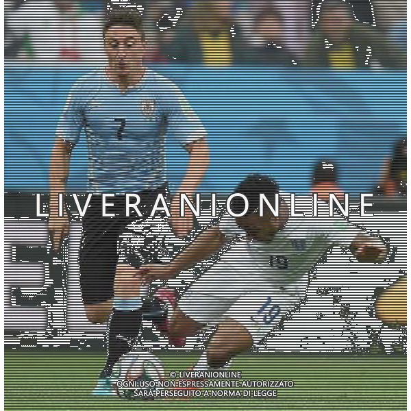 (140619) -- SAO PAULO, June 19, 2014 () -- Uruguay\'s Cristian Rodriguez (L) vies with England\'s Raheem Sterling during a Group D match between Uruguay and England of 2014 FIFA World Cup at the Arena de Sao Paulo Stadium in Sao Paulo, Brazil, June 19, 2014.(/Li Ga)(pcy) 2014 FIFA World Cup Brazil Group D match between Uruguay and England at Arena de Sao Paulo on June 19, 2014 in Sao Paulo, Brazil. ©photoshot/Agenzia Aldo Liverani sas - ITALY ONLY - EDITORIAL USE ONLY