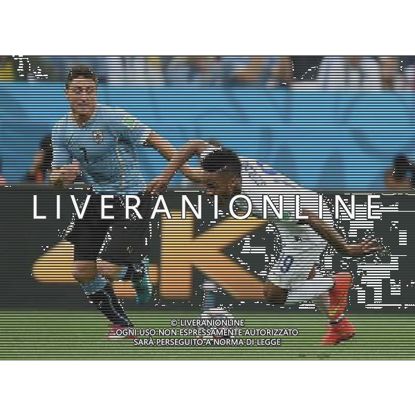 (140619) -- SAO PAULO, June 19, 2014 () -- Uruguay\'s Cristian Rodriguez (L) vies with England\'s Raheem Sterling during a Group D match between Uruguay and England of 2014 FIFA World Cup at the Arena de Sao Paulo Stadium in Sao Paulo, Brazil, June 19, 2014.(/Li Ga)(pcy) 2014 FIFA World Cup Brazil Group D match between Uruguay and England at Arena de Sao Paulo on June 19, 2014 in Sao Paulo, Brazil. ©photoshot/Agenzia Aldo Liverani sas - ITALY ONLY - EDITORIAL USE ONLY