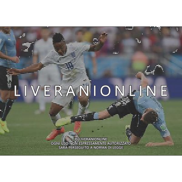 (140619) -- SAO PAULO, June 19, 2014 () -- England\'s Raheem Sterling (L) competes with Uruguay\'s Jose Maria Gimenez during a Group D match between Uruguay and England of 2014 FIFA World Cup at the Arena de Sao Paulo Stadium in Sao Paulo, Brazil, June 19, 2014.(/Li Ga)(pcy) 2014 FIFA World Cup Brazil Group D match between Uruguay and England at Arena de Sao Paulo on June 19, 2014 in Sao Paulo, Brazil. ©photoshot/Agenzia Aldo Liverani sas - ITALY ONLY - EDITORIAL USE ONLY