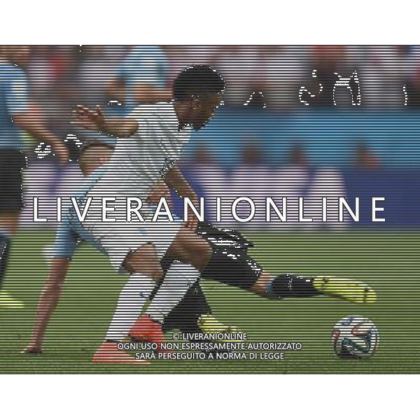 (140619) -- SAO PAULO, June 19, 2014 () -- England\'s Raheem Sterling competes with Uruguay\'s Jose Maria Gimenez during a Group D match between Uruguay and England of 2014 FIFA World Cup at the Arena de Sao Paulo Stadium in Sao Paulo, Brazil, June 19, 2014.(/Li Ga)(pcy) 2014 FIFA World Cup Brazil Group D match between Uruguay and England at Arena de Sao Paulo on June 19, 2014 in Sao Paulo, Brazil. ©photoshot/Agenzia Aldo Liverani sas - ITALY ONLY - EDITORIAL USE ONLY