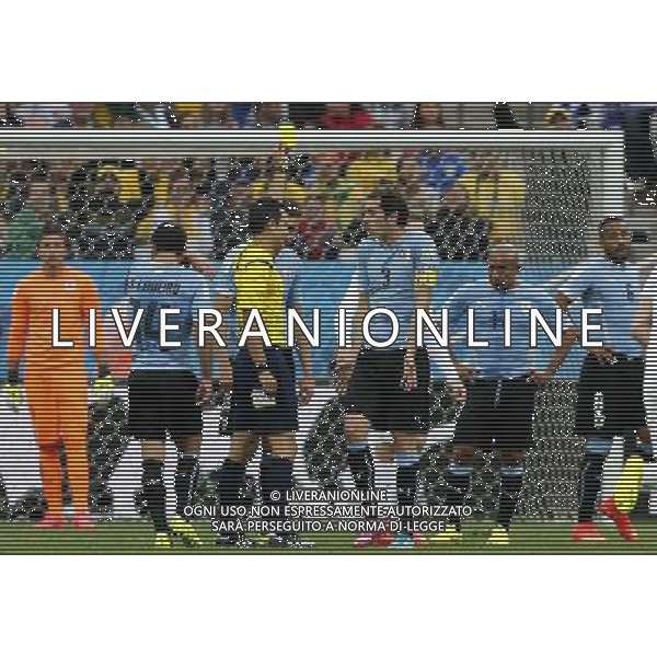 (140619) -- SAO PAULO, June 19, 2014 () -- Spain\'s referee Carlos Velasco Carballo (L, front) gives a yellow card to Uruguay\'s Diego Godin (R, front) during a Group D match between Uruguay and England of 2014 FIFA World Cup at the Arena de Sao Paulo Stadium in Sao Paulo, Brazil, June 19, 2014.(/Zhou Lei)(pcy) 2014 FIFA World Cup Brazil Group D match between Uruguay and England at Arena de Sao Paulo on June 19, 2014 in Sao Paulo, Brazil. ©photoshot/Agenzia Aldo Liverani sas - ITALY ONLY - EDITORIAL USE ONLY