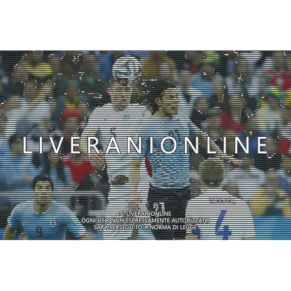 (140619) -- SAO PAULO, June 19, 2014 () -- Uruguay\'s Edinson Cavani competes for a header with England\'s Gary Cahill during a Group D match between Uruguay and England of 2014 FIFA World Cup at the Arena de Sao Paulo Stadium in Sao Paulo, Brazil, June 19, 2014.(/Chen Jianli)(rh) 2014 FIFA World Cup Brazil Group D match between Uruguay and England at Arena de Sao Paulo on June 19, 2014 in Sao Paulo, Brazil. ©photoshot/Agenzia Aldo Liverani sas - ITALY ONLY - EDITORIAL USE ONLY
