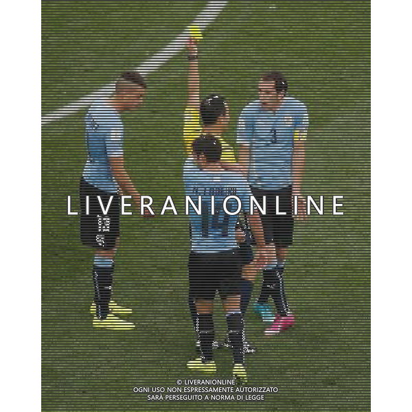 (140619) -- SAO PAULO, June 19, 2014 () -- Spain\'s referee Carlos Velasco Carballo (C) gives a yellow card to Uruguay\'s Diego Godin (R) during a Group D match between Uruguay and England of 2014 FIFA World Cup at the Arena de Sao Paulo Stadium in Sao Paulo, Brazil, June 19, 2014.(/Liao Yujie)(rh) 2014 FIFA World Cup Brazil Group D match between Uruguay and England at Arena de Sao Paulo on June 19, 2014 in Sao Paulo, Brazil. ©photoshot/Agenzia Aldo Liverani sas - ITALY ONLY - EDITORIAL USE ONLY