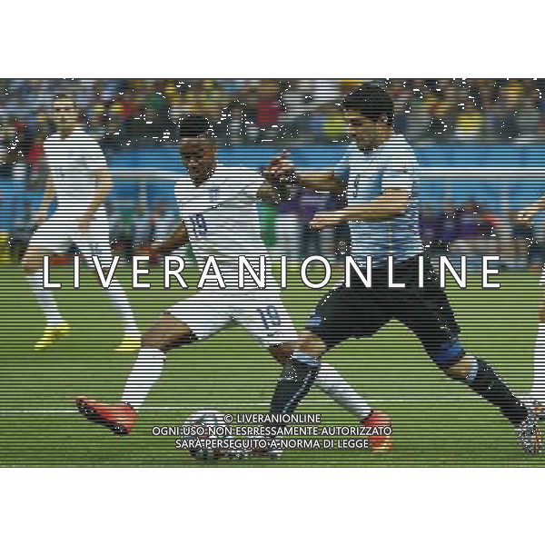 (140619) -- SAO PAULO, June 19, 2014 () -- Uruguay\'s Luis Suarez vies with England\'s Raheem Sterling during a Group D match between Uruguay and England of 2014 FIFA World Cup at the Arena de Sao Paulo Stadium in Sao Paulo, Brazil, June 19, 2014.(/Chen Jianli)(rh) 2014 FIFA World Cup Brazil Group D match between Uruguay and England at Arena de Sao Paulo on June 19, 2014 in Sao Paulo, Brazil. ©photoshot/Agenzia Aldo Liverani sas - ITALY ONLY - EDITORIAL USE ONLY