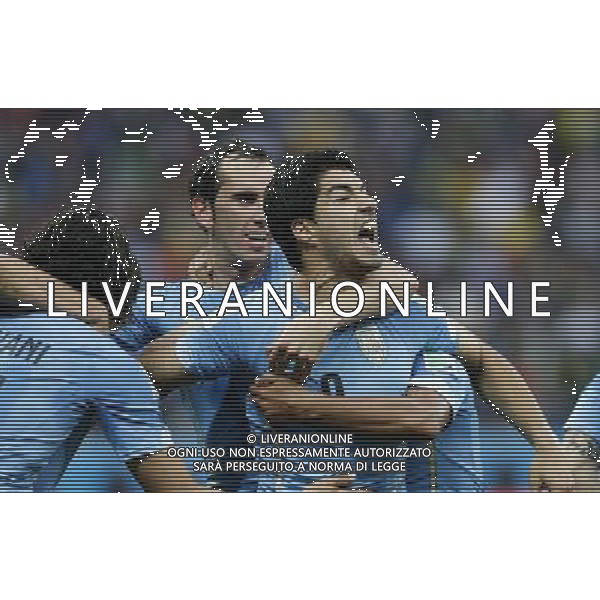 (140619) -- SAO PAULO, June 19, 2014 () -- Uruguay\'s Luis Suarez (R) celebrates for his goal with his teammates during a Group D match between Uruguay and England of 2014 FIFA World Cup at the Arena de Sao Paulo Stadium in Sao Paulo, Brazil, June 19, 2014.(/Zhou Lei)(pcy) 2014 FIFA World Cup Brazil Group D match between Uruguay and England at Arena de Sao Paulo on June 19, 2014 in Sao Paulo, Brazil. ©photoshot/Agenzia Aldo Liverani sas - ITALY ONLY - EDITORIAL USE ONLY