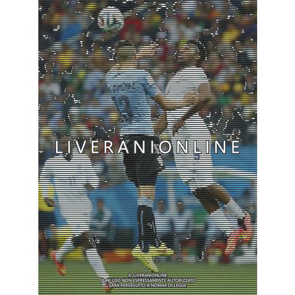 (140619) -- SAO PAULO, June 19, 2014 () -- Uruguay\'s Jose Maria Gimenez competes for a header with England\'s Daniel Sturridge during a Group D match between Uruguay and England of 2014 FIFA World Cup at the Arena de Sao Paulo Stadium in Sao Paulo, Brazil, June 19, 2014.(/Chen Jianli)(rh) 2014 FIFA World Cup Brazil Group D match between Uruguay and England at Arena de Sao Paulo on June 19, 2014 in Sao Paulo, Brazil. ©photoshot/Agenzia Aldo Liverani sas - ITALY ONLY - EDITORIAL USE ONLY
