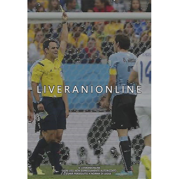 (140619) -- SAO PAULO, June 19, 2014 () -- Spain\'s referee Carlos Velasco Carballo (L) gives a yellow card to Uruguay\'s Diego Godin (R) during a Group D match between Uruguay and England of 2014 FIFA World Cup at the Arena de Sao Paulo Stadium in Sao Paulo, Brazil, June 19, 2014.(/Zhou Lei)(pcy) 2014 FIFA World Cup Brazil Group D match between Uruguay and England at Arena de Sao Paulo on June 19, 2014 in Sao Paulo, Brazil. ©photoshot/Agenzia Aldo Liverani sas - ITALY ONLY - EDITORIAL USE ONLY