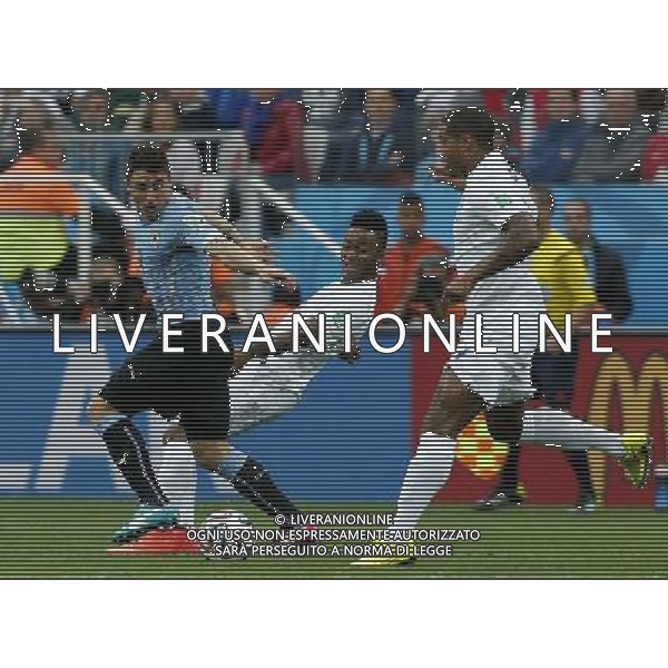 (140619) -- SAO PAULO, June 19, 2014 () -- Uruguay\'s Cristian Rodriguez (L) competes with England\'s Raheem Sterling (C) and Glen Johnson during a Group D match between Uruguay and England of 2014 FIFA World Cup at the Arena de Sao Paulo Stadium in Sao Paulo, Brazil, June 19, 2014.(/Zhou Lei)(pcy) 2014 FIFA World Cup Brazil Group D match between Uruguay and England at Arena de Sao Paulo on June 19, 2014 in Sao Paulo, Brazil. ©photoshot/Agenzia Aldo Liverani sas - ITALY ONLY - EDITORIAL USE ONLY
