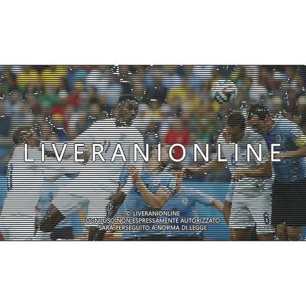 (140619) -- SAO PAULO, June 19, 2014 () -- Uruguay\'s Diego Godin (1st R) competes for a header with England\'s Phil Jagielka (2ND R) during a Group D match between Uruguay and England of 2014 FIFA World Cup at the Arena de Sao Paulo Stadium in Sao Paulo, Brazil, June 19, 2014.(/Chen Jianli)(rh) 2014 FIFA World Cup Brazil Group D match between Uruguay and England at Arena de Sao Paulo on June 19, 2014 in Sao Paulo, Brazil. ©photoshot/Agenzia Aldo Liverani sas - ITALY ONLY - EDITORIAL USE ONLY