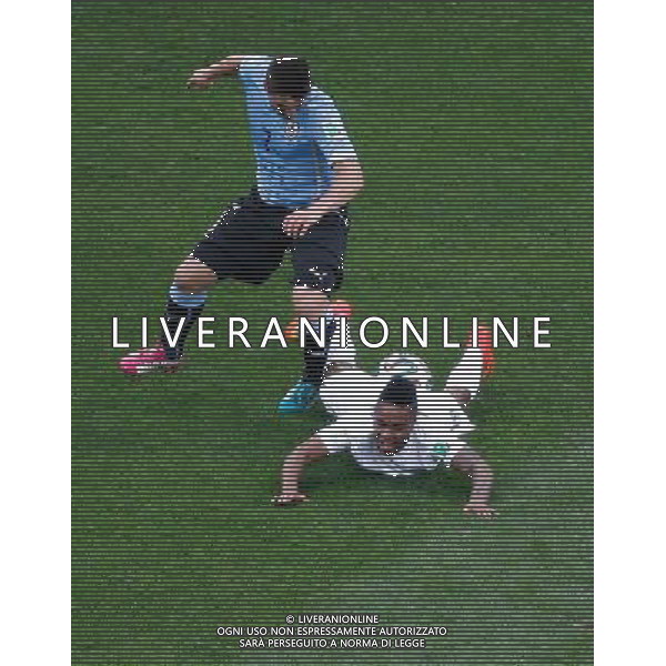 (140619) -- SAO PAULO, June 19, 2014 () -- Uruguay\'s Cristian Rodr®™guez vies for the ball with England\'s Raheem Sterling during a Group D match between Uruguay and England of 2014 FIFA World Cup at the Arena de Sao Paulo Stadium in Sao Paulo, Brazil, June 19, 2014.(/Liao Yujie)(rh) 2014 FIFA World Cup Brazil Group D match between Uruguay and England at Arena de Sao Paulo on June 19, 2014 in Sao Paulo, Brazil. ©photoshot/Agenzia Aldo Liverani sas - ITALY ONLY - EDITORIAL USE ONLY