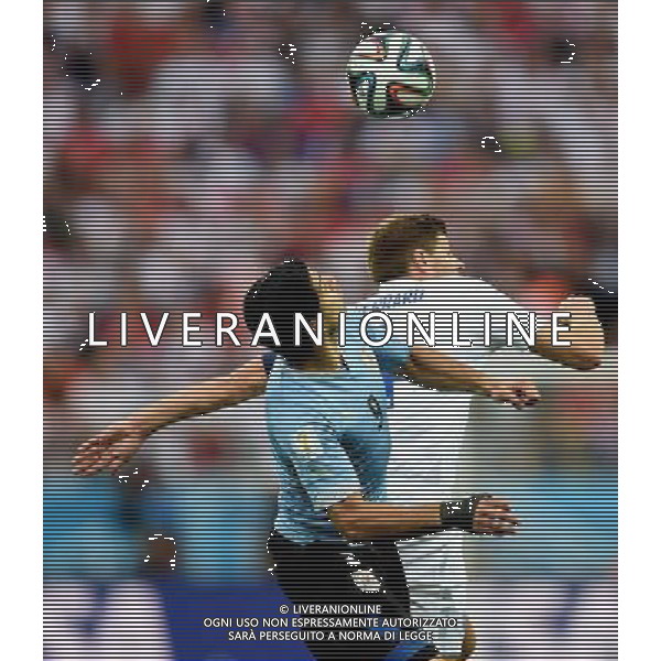 (140619) -- SAO PAULO, June 19, 2014 () -- Uruguay\'s Luis Suarez competes a header with England\'s Steven Gerrard during a Group D match between Uruguay and England of 2014 FIFA World Cup at the Arena de Sao Paulo Stadium in Sao Paulo, Brazil, June 19, 2014.(/Li Ga)(rh) 2014 FIFA World Cup Brazil Group D match between Uruguay and England at Arena de Sao Paulo on June 19, 2014 in Sao Paulo, Brazil. ©photoshot/Agenzia Aldo Liverani sas - ITALY ONLY - EDITORIAL USE ONLY