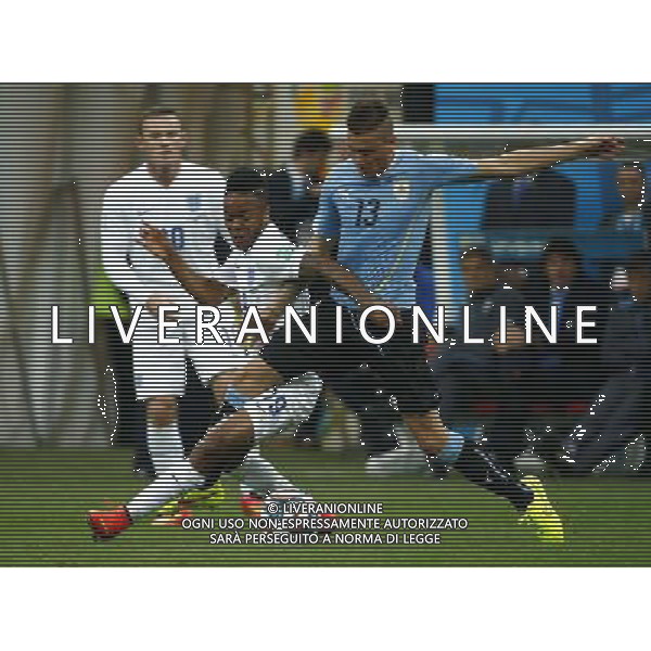 (140619) -- SAO PAULO, June 19, 2014 () -- Uruguay\'s Jose Maria Gimenez vies with England\'s Raheem Sterling during a Group D match between Uruguay and England of 2014 FIFA World Cup at the Arena de Sao Paulo Stadium in Sao Paulo, Brazil, June 19, 2014.(/Chen Jianli)(rh) 2014 FIFA World Cup Brazil Group D match between Uruguay and England at Arena de Sao Paulo on June 19, 2014 in Sao Paulo, Brazil. ©photoshot/Agenzia Aldo Liverani sas - ITALY ONLY - EDITORIAL USE ONLY