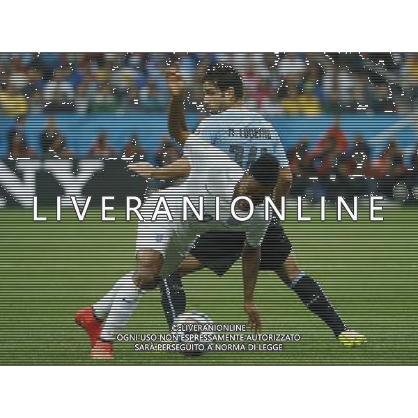 (140619) -- SAO PAULO, June 19, 2014 () -- England\'s Raheem Sterling (front) vies with Uruguay\'s Nicolas Lodeiro during a Group D match between Uruguay and England of 2014 FIFA World Cup at the Arena de Sao Paulo Stadium in Sao Paulo, Brazil, June 19, 2014.(/Chen Jianli)(pcy) 2014 FIFA World Cup Brazil Group D match between Uruguay and England at Arena de Sao Paulo on June 19, 2014 in Sao Paulo, Brazil. ©photoshot/Agenzia Aldo Liverani sas - ITALY ONLY - EDITORIAL USE ONLY