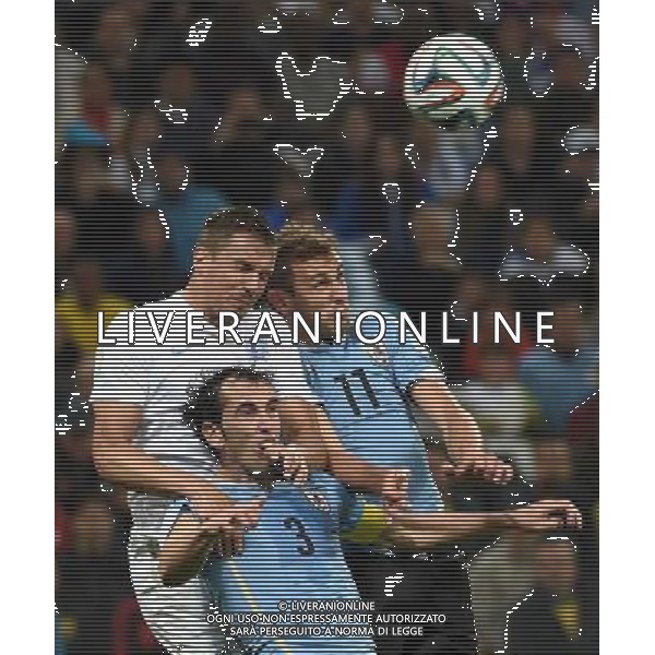 (140619) -- SAO PAULO, June 19, 2014 () -- England\'s Rickie Lambert (C) competes for a header with Uruguay\'s Diego Godin (L) and Cristian Stuani during a Group D match between Uruguay and England of 2014 FIFA World Cup at the Arena de Sao Paulo Stadium in Sao Paulo, Brazil, June 19, 2014.Uruguay won 2-1 over England on Thursday.(/Li Ga)(pcy) ©photoshot/Agenzia Aldo Liverani sas - ITALY ONLY - EDITORIAL USE ONLY