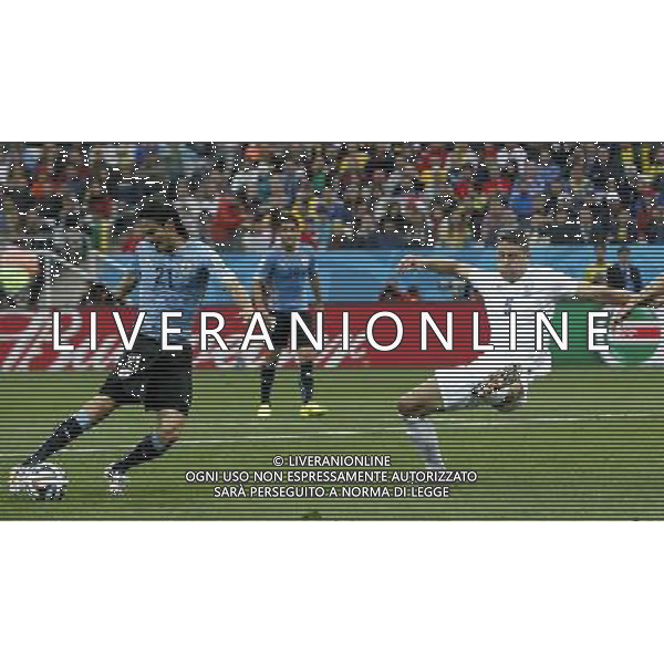 (140619) -- SAO PAULO, June 19, 2014 () -- Uruguay\'s Edinson Cavani (L) shoots the ball during a Group D match between Uruguay and England of 2014 FIFA World Cup at the Arena de Sao Paulo Stadium in Sao Paulo, Brazil, June 19, 2014.Uruguay won 2-1 over England on Thursday.(/Zhou Lei)(pcy) ©photoshot/Agenzia Aldo Liverani sas - ITALY ONLY - EDITORIAL USE ONLY