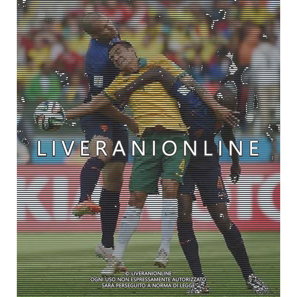 (140618) -- PORTO ALEGRE, June 18, 2014 () -- Australia\'s Tim Cahill (C) competes for a header with Netherlands\' Bruno Martins Indi (R) and Ron Vlaar (L) during a Group B match between Australia and Netherlands of 2014 FIFA World Cup at the Estadio Beira-Rio Stadium in Porto Alegre, Brazil, June 18, 2014.Netherlands won 3-2 over Australia on Wednesday.(/Li Ga)(pcy) ©photoshot/Agenzia Aldo Liverani sas - ITALY ONLY - EDITORIAL USE ONLY
