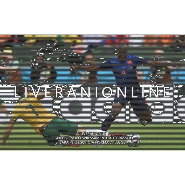 (140618) -- PORTO ALEGRE, June 18, 2014 () -- Australia\'s Matthew Leckie (L) vies with Netherlands\'s Bruno Martins Indi during a Group B match between Australia and Netherlands of 2014 FIFA World Cup at the Estadio Beira-Rio Stadium in Porto Alegre, Brazil, June 18, 2014.Netherlands won 3-2 over Australia on Wednesday.(/Li Ga)(pcy) ©photoshot/Agenzia Aldo Liverani sas - ITALY ONLY - EDITORIAL USE ONLY