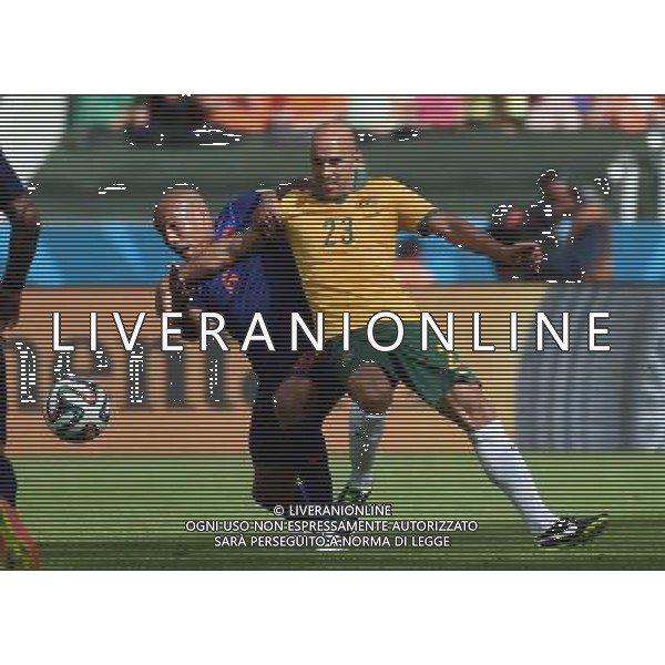 (140618) -- PORTO ALEGRE, June 18, 2014 () -- Australia\'s Mark Bresciano (R) vies with Netherlands\'s Nigel de Jong during a Group B match between Australia and Netherlands of 2014 FIFA World Cup at the Estadio Beira-Rio Stadium in Porto Alegre, Brazil, June 18, 2014.Netherlands won 3-2 over Australia on Wednesday.(/Li Ga)(pcy) ©photoshot/Agenzia Aldo Liverani sas - ITALY ONLY - EDITORIAL USE ONLY