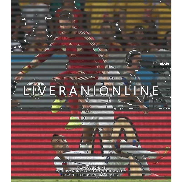 (140618) -- RIO DE JANEIRO, June 18, 2014 () -- Spain\'s Sergio Ramos (front) jumps with the ball during a Group B match between Spain and Chile of 2014 FIFA World Cup at the Estadio do Maracana Stadium in Rio de Janeiro, Brazil, June 18, 2014. Chile won 2-0 over Spain on Wednesday.(/Xu Zijian)(pcy) ©photoshot/Agenzia Aldo Liverani sas - ITALY ONLY - EDITORIAL USE ONLY