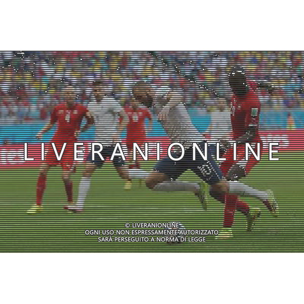 (140620) -- SALVADOR, June 20, 2014 () -- France\'s Karim Benzema (L, front) gets stumbled by Switzerland\'s Johan Djourouce (R, front) during a Group E match between Switzerland and France of 2014 FIFA World Cup at the Arena Fonte Nova Stadium in Salvador, Brazil, on June 20, 2014.(/Cao Can)(pcy) AG ALDO LIVERANI SAS ONLY ITALY