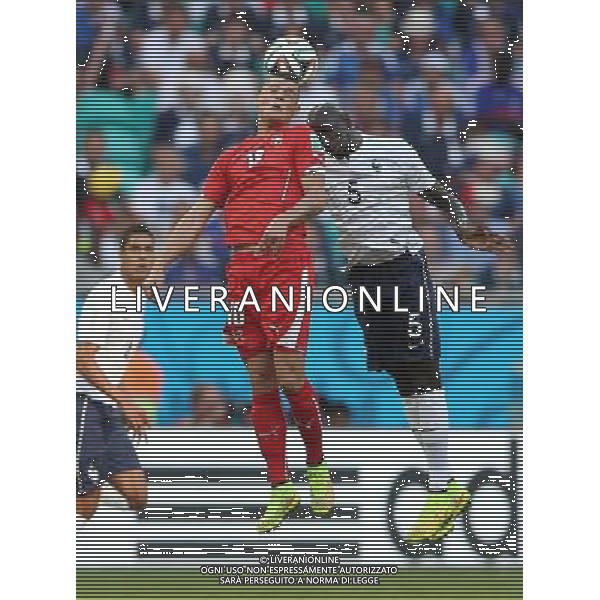 (140620) -- SALVADOR, June 20, 2014 () -- Switzerland\'s Granit Xhaka (C) comeptes for a header with France\'s Mamadou Sakho (R) during a Group E match between Switzerland and France of 2014 FIFA World Cup at the Arena Fonte Nova Stadium in Salvador, Brazil, on June 20, 2014.(/Cao Can)(pcy) AG ALDO LIVERANI SAS ONLY ITALY