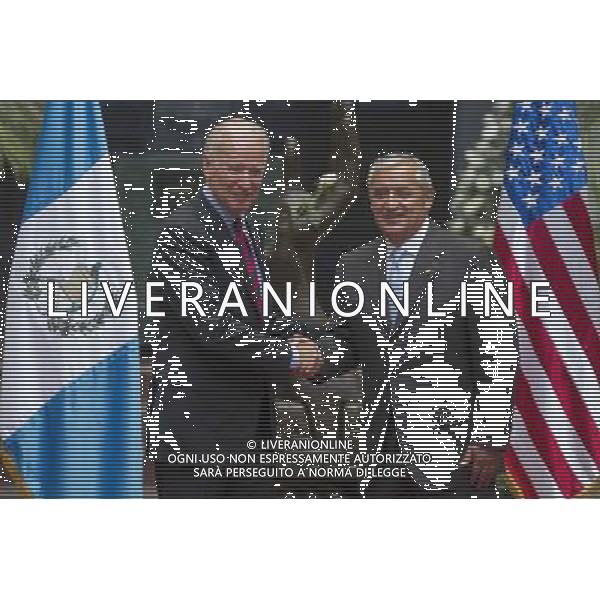 (140620) -- GUATEMALA CITY, June 20, 2014 () -- U.S. Vice President Joe Biden (L), shakes hands with Guatemala\'s President Otto Perez Molina, upon his arrival at the National Palace of Culture, in Guatemala City, capital of Guatemala, on June 20, 2014. Biden arrived in Guatemala City on Friday as part of his Latin American tour to discuss the rising tide of unaccompanied Central American minors crossing the U.S. border. (/Luis Echeverria) (jg) (sp) AG ALDOL IVERANI SAS ONLY ITALY