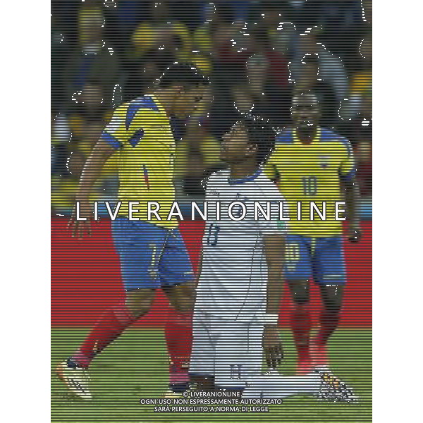 (140620) -- CURITIBA, June 20, 2014 () -- Carlo Costly (R) of Honduras argues with Jefferson Montero of Ecuador during a Group E match between Honduras and Ecuador of 2014 FIFA World Cup at the Arena da Baixada Stadium in Curitiba, Brazil, June 20, 2014. Ecuador beat Honduras 2-1. (/Zhou Lei)(zc) AG ALDO LIVERANI SAS ONLY ITALY