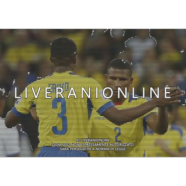 (140620) -- CURITIBA, June 20, 2014 () -- Jorge Guagua (R) of Ecuador celebraes with his teammate Frickson Erazo after winning a Group E match between Honduras and Ecuador of 2014 FIFA World Cup at the Arena da Baixada Stadium in Curitiba, Brazil, June 20, 2014. Ecuador beat Honduras 2-1. (/Liao Yujie)(zc) AG ALDO LIVERANI SAS ONLY ITALY