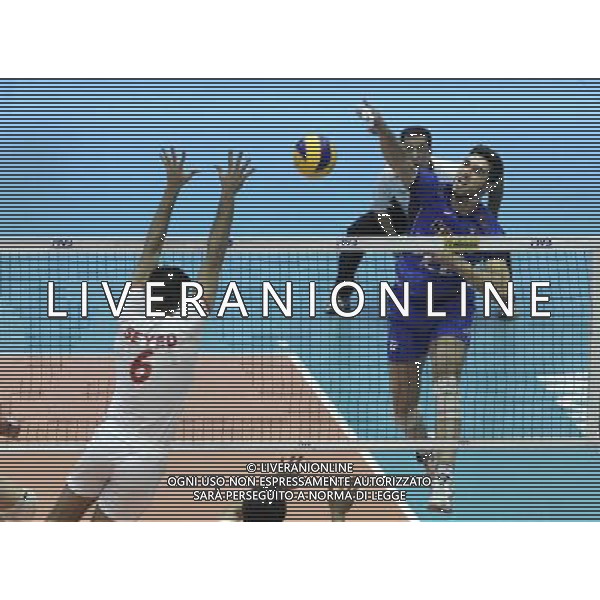 (140621) -- TEHRAN, Jun. 21, 2014 () -- Luigi Randazzo (R) of Italy spikes the ball during the match against Iran during FIVB Men\'s Volleyball World League 2014 at Azadi Stadium in Tehran, Iran, on June 20, 2014. Iran won 3-0. (/Ahmad Halabisaz) AG ALDO LIVERANI SAS ONLY ITALY