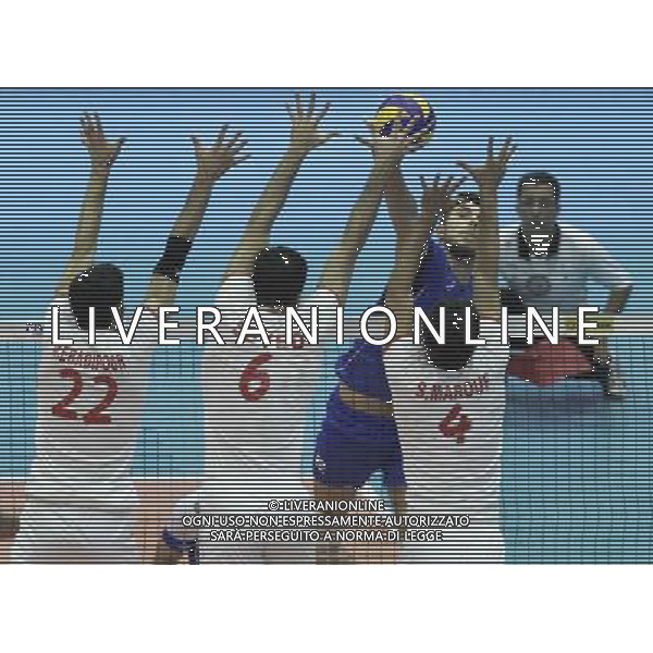 (140621) -- TEHRAN, Jun. 21, 2014 () -- Luigi Randazzo (in blue) of Italy spikes the ball during the match against Iran during FIVB Men\'s Volleyball World League 2014 at Azadi Stadium in Tehran, Iran, on June 20, 2014. Iran won 3-0. (/Ahmad Halabisaz) AG ALDO LIVERANI SAS ONLY ITALY