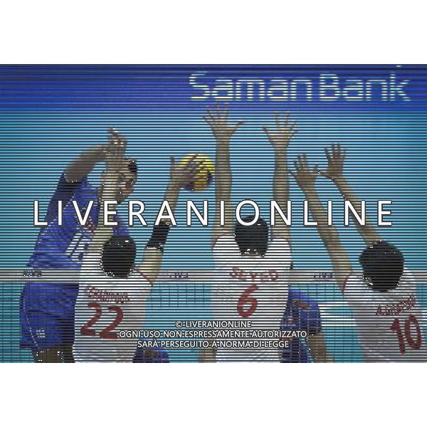 (140621) -- TEHRAN, Jun. 21, 2014 () -- Giulio Sabbi (L) of Italy spikes the ball during their match against Iran during FIVB Men\'s Volleyball World League 2014 at Azadi Stadium in Tehran, Iran, on June 20, 2014. Iran won 3-0. (/Ahmad Halabisaz) AG ALDO LIVERANI SAS ONLY ITALY