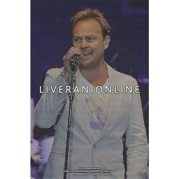 Jason Donovan performs on stage at the Hampton Court Palace Festival, East Molesey, Surrey on Friday 20 June 2014. ©PHOTOSHOT/AGENZIA ALDO LIVERANI SAS - ITALY ONLY - EDITORIAL USE ONLY
