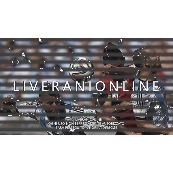 (140621) -- BELO HORIZONTE, June 21, 2014 () -- Marcos Rojo (L) and Javier Mascherano (R) of Argentina compete for the header with Reza Ghoochannejad of Iran during a Group F match between Argentina and Iran of 2014 FIFA World Cup at the Estadio Mineirao Stadium in Belo Horizonte, Brazil, June 21, 2014. (/Qi Heng)(wll) ©PHOTOSHOT/AGENZIA ALDO LIVERANI SAS - ITALY ONLY - EDITORIAL USE ONLY - ARGENTINA Vs IRAN partita del gruppo di F Coppa del mondo FIFA 2014 Mineirao stadio Estadio a Belo Horizonte, in Brasile, 21 giugno 2014