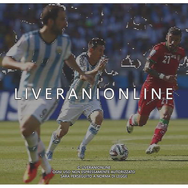 (140621) -- BELO HORIZONTE, June 21, 2014 () -- Lionel Messi (C) of Aregentina runs with the ball during a Group F match between Argentina and Iran of 2014 FIFA World Cup at the Estadio Mineirao Stadium in Belo Horizonte, Brazil, June 21, 2014. (/Liu Bin)(zc) ©PHOTOSHOT/AGENZIA ALDO LIVERANI SAS - ITALY ONLY - EDITORIAL USE ONLY - ARGENTINA Vs IRAN partita del gruppo di F Coppa del mondo FIFA 2014 Mineirao stadio Estadio a Belo Horizonte, in Brasile, 21 giugno 2014