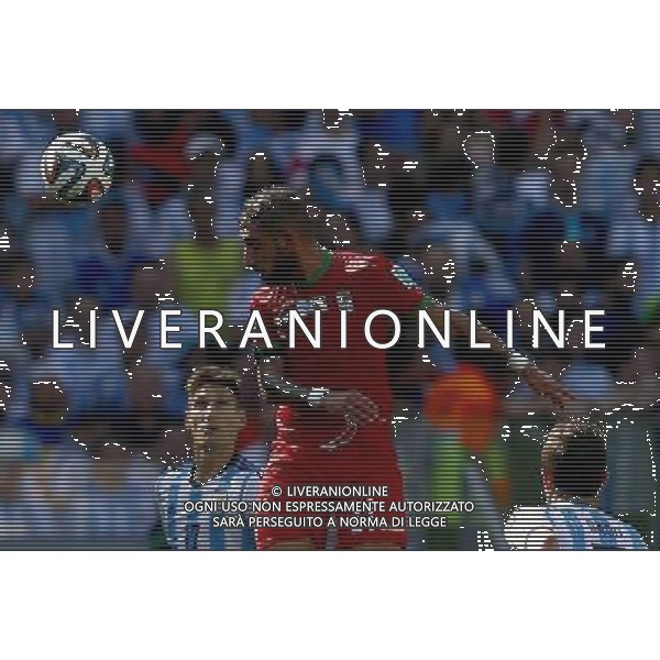 (140621) -- BELO HORIZONTE, June 21, 2014 () -- Ashkan Dejagah (C) of Iran heads the ball during a Group F match between Argentina and Iran of 2014 FIFA World Cup at the Estadio Mineirao Stadium in Belo Horizonte, Brazil, June 21, 2014. (/Liu Bin)(zc) ©PHOTOSHOT/AGENZIA ALDO LIVERANI SAS - ITALY ONLY - EDITORIAL USE ONLY - ARGENTINA Vs IRAN partita del gruppo di F Coppa del mondo FIFA 2014 Mineirao stadio Estadio a Belo Horizonte, in Brasile, 21 giugno 2014