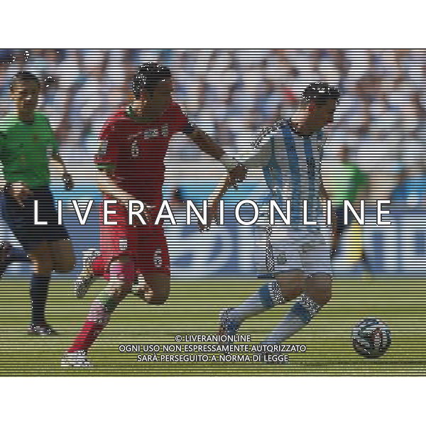 (140621) -- BELO HORIZONTE, June 21, 2014 () -- Javad Nekounam (L) of Iran defends against Lionel Messi of Argentina during a Group F match between Argentina and Iran of 2014 FIFA World Cup at the Estadio Mineirao Stadium in Belo Horizonte, Brazil, June 21, 2014. (/Liu Bin)(zc) ©PHOTOSHOT/AGENZIA ALDO LIVERANI SAS - ITALY ONLY - EDITORIAL USE ONLY - ARGENTINA Vs IRAN partita del gruppo di F Coppa del mondo FIFA 2014 Mineirao stadio Estadio a Belo Horizonte, in Brasile, 21 giugno 2014