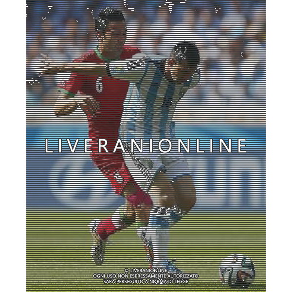 (140621) -- BELO HORIZONTE, June 21, 2014 () -- Javad Nekounam (L) of Iran defends against Lionel Messi of Argentina during a Group F match between Argentina and Iran of 2014 FIFA World Cup at the Estadio Mineirao Stadium in Belo Horizonte, Brazil, June 21, 2014. (/Liu Bin)(zc) ©PHOTOSHOT/AGENZIA ALDO LIVERANI SAS - ITALY ONLY - EDITORIAL USE ONLY - ARGENTINA Vs IRAN partita del gruppo di F Coppa del mondo FIFA 2014 Mineirao stadio Estadio a Belo Horizonte, in Brasile, 21 giugno 2014