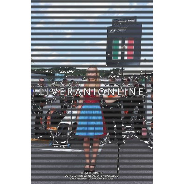 Grid girl for Sergio Perez (MEX) Sahara Force India F1 VJM07. 22.06.2014. Formula 1 World Championship, Rd 8, Austrian Grand Prix, Spielberg, Austria, Race Day. - www.xpbimages.com, EMail: requests@xpbimages.com - copy of publication required for printed pictures. Every used picture is fee-liable. © Copyright: Moy / XPB Images AG ALDO LIVERANI SAS ONLY ITALY