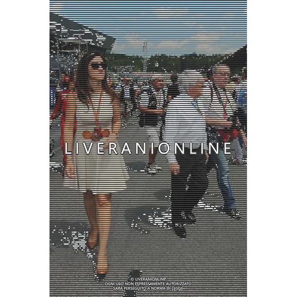 Bernie Ecclestone (GBR) with his wife Fabiana Flosi (BRA) on the grid. 22.06.2014. Formula 1 World Championship, Rd 8, Austrian Grand Prix, Spielberg, Austria, Race Day. - www.xpbimages.com, EMail: requests@xpbimages.com - copy of publication required for printed pictures. Every used picture is fee-liable. © Copyright: Moy / XPB Images AG ALDO LIVERANI SAS ONLY ITALY