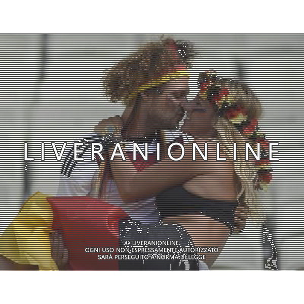 (140621) -- FORTALEZA, June 21, 2014 () -- Two fans of Germany kiss ahead of a Group G match between Germany and Ghana of 2014 FIFA World Cup at the Estadio Mineirao Stadium in Fortaleza, Brazil, June 21, 2014. (/Yang Lei)(zc) ©PHOTOSHOT/AGENZIA ALDO LIVERANI SAS - ITALY ONLY - EDITORIAL USE ONLY - GERMANIA Vs GHANA Partita del gruppo G Coppa del mondo 2014 FIFA World Cup Castelao stadio Estadio a Fortaleza, in Brasile, 21 giugno 2014